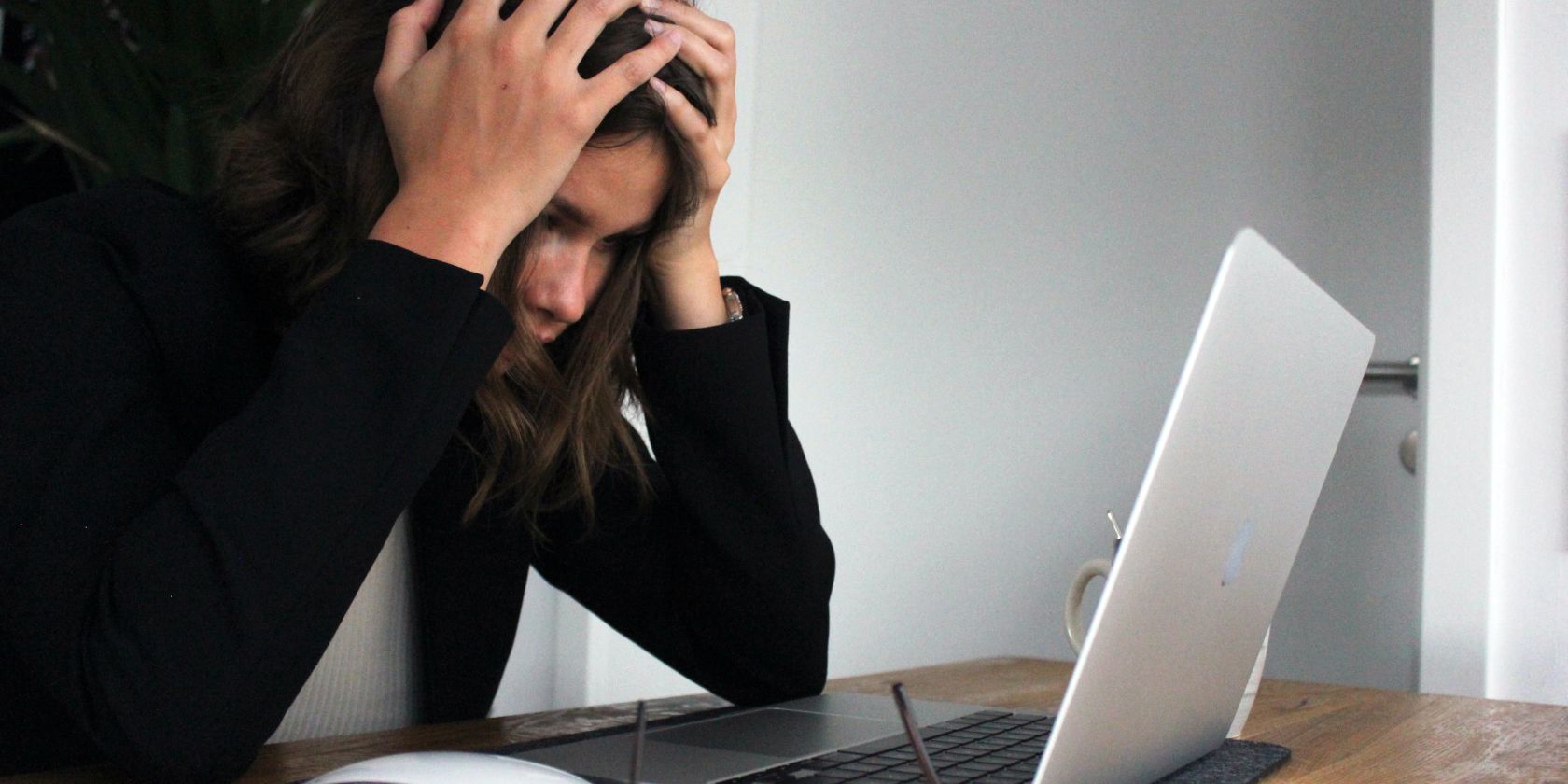 A woman wearing black getting frustrated