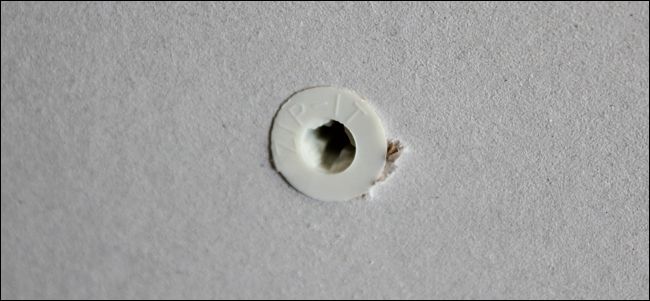 Фото: установленный винтовой анкер с вкрученным шурупом