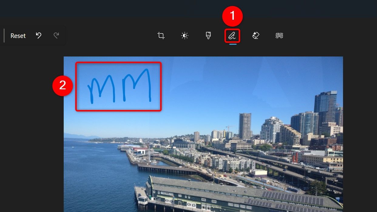 The 'Mark-up' tool and a drawing-based watermark highlighted in Photos.