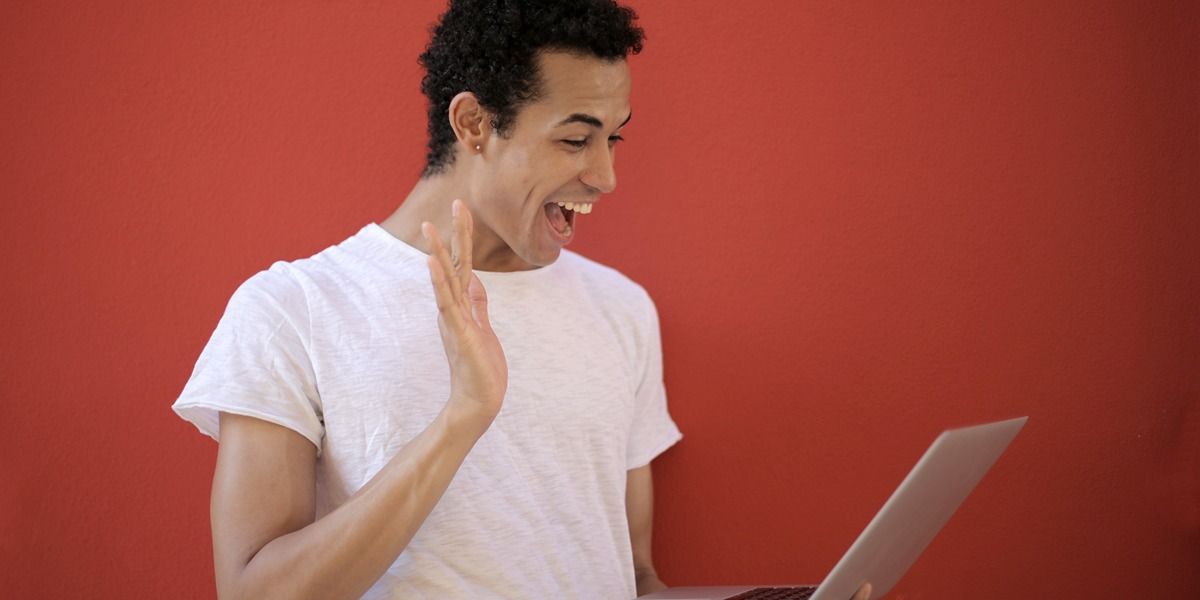 man talking to laptop