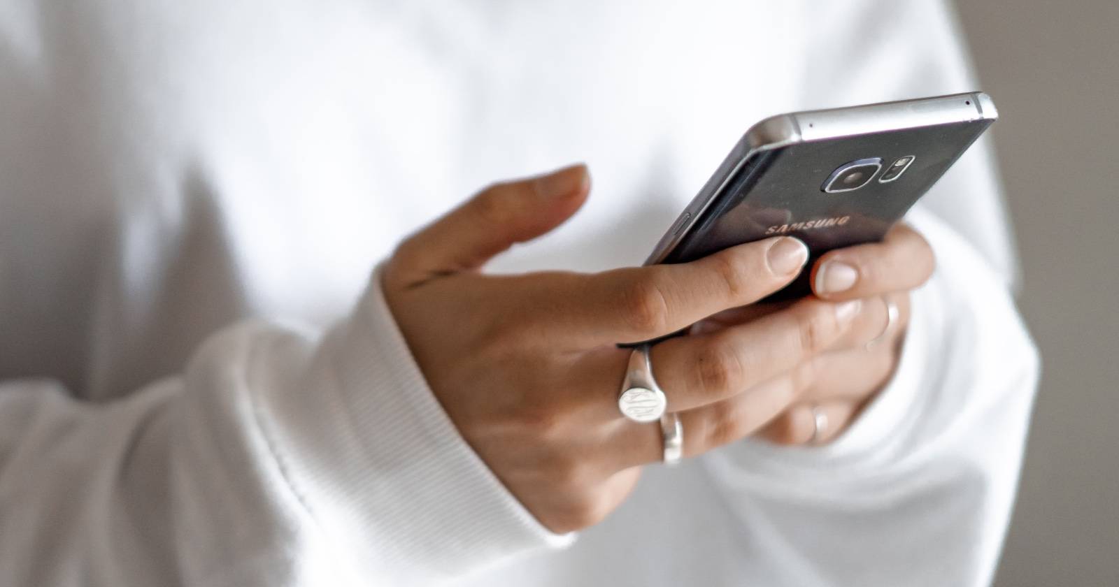 Woman texting on an Android phone