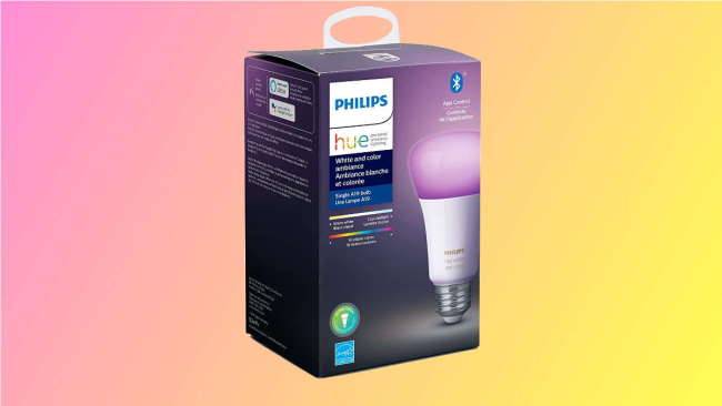 Коробка Philips Hue на розово-жёлтом фоне.