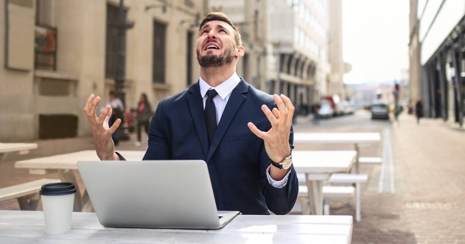 Man Lamenting on Laptop 