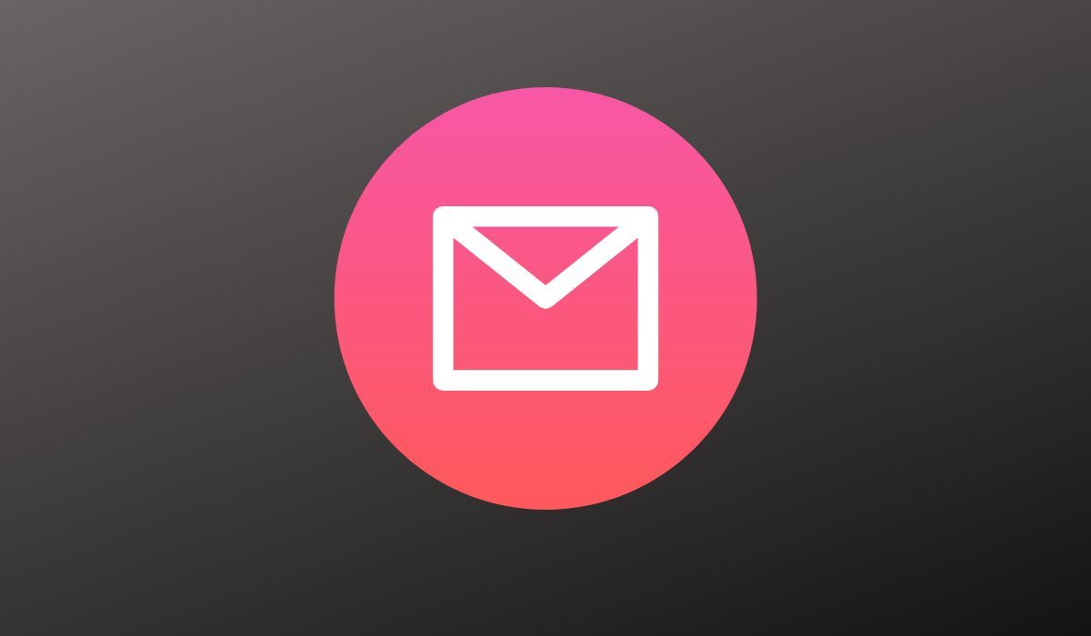 Pink and white email symbol seen on dark background