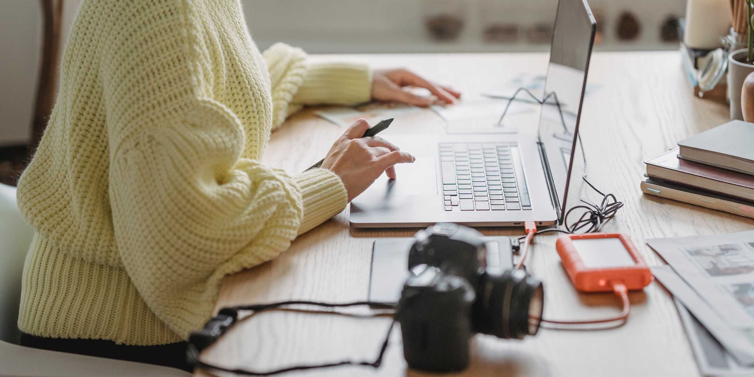 An external hard disk drive plugged into a laptop