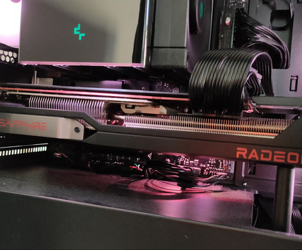 A used AMD RX 6800 XT graphics card inside of a PC.