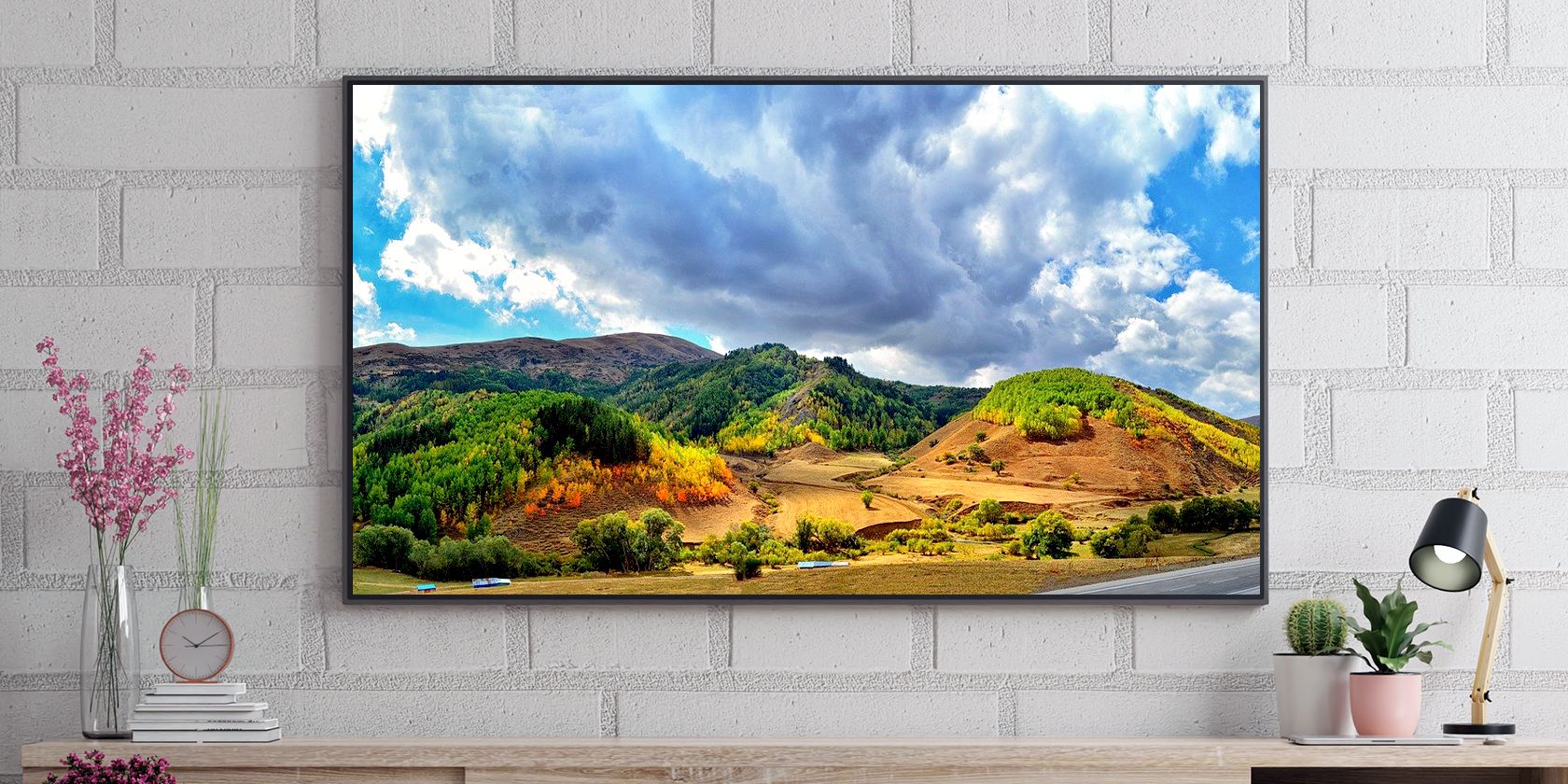 An HDR QD-OLED TV on a brick wall
