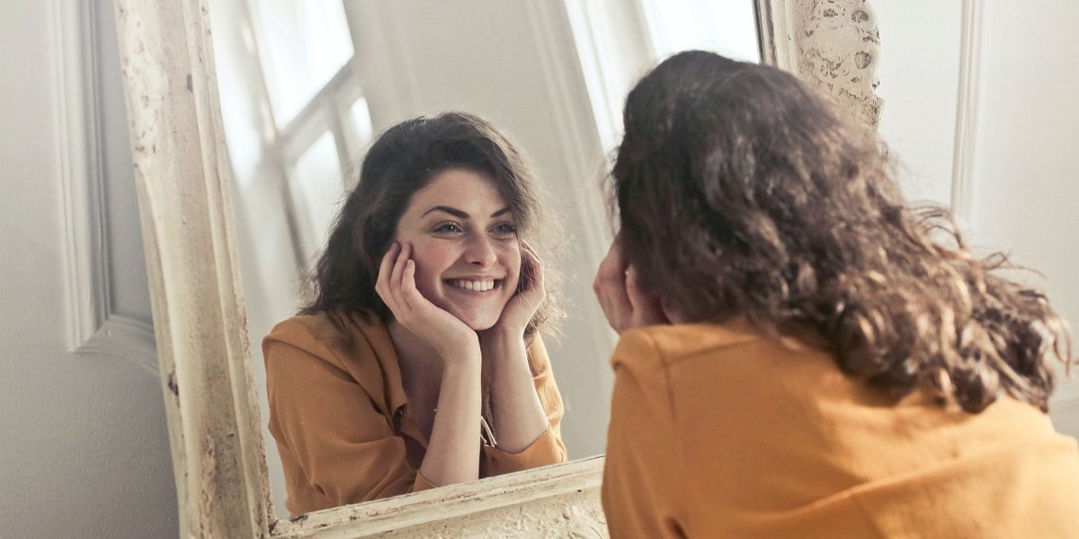 Woman looking in the mirror