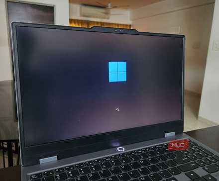 Lenovo laptop showing Windows 11 startup screen.