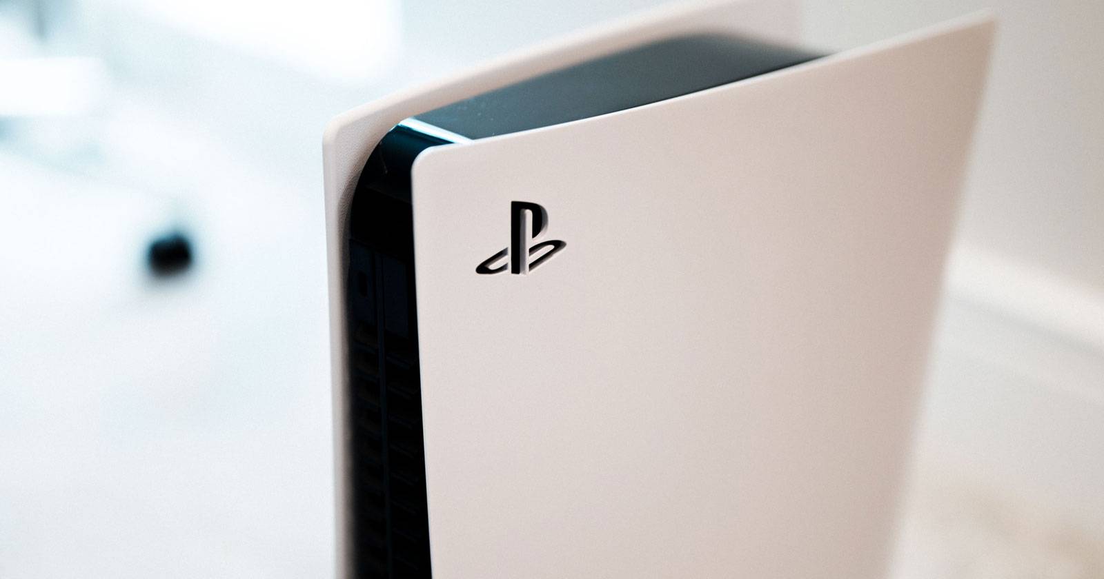 PS5 console in vertical orientation showing PS logo