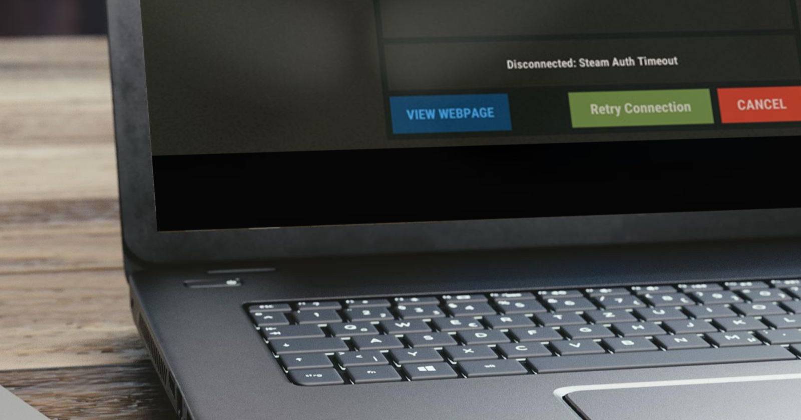 Сообщение «Steam Auth Timeout» на экране ноутбука, стоящего на столе