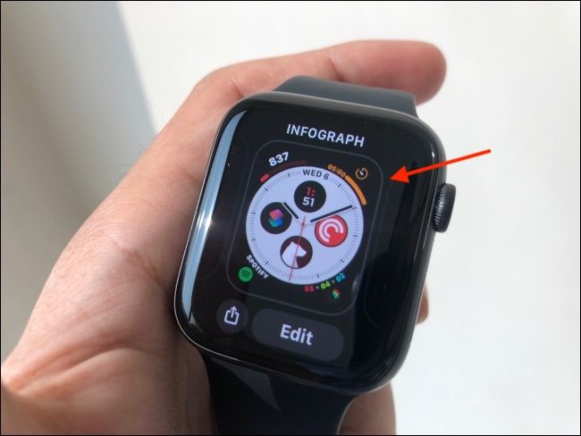 Tap and hold the watch face to pick it up