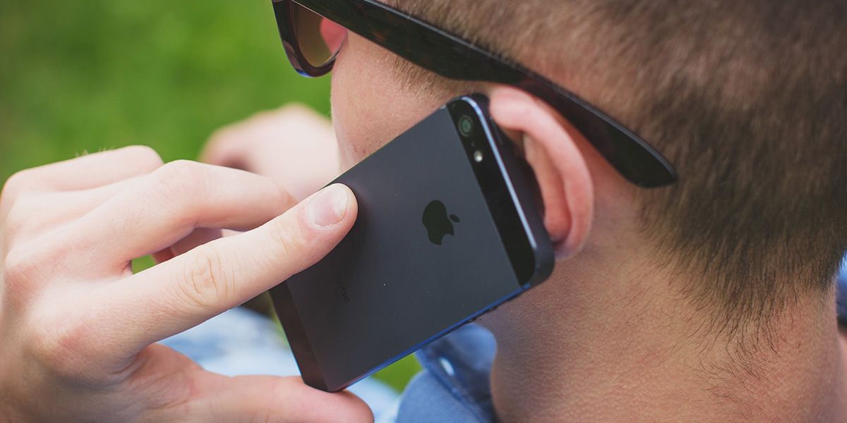 man on a phone call using iPhone