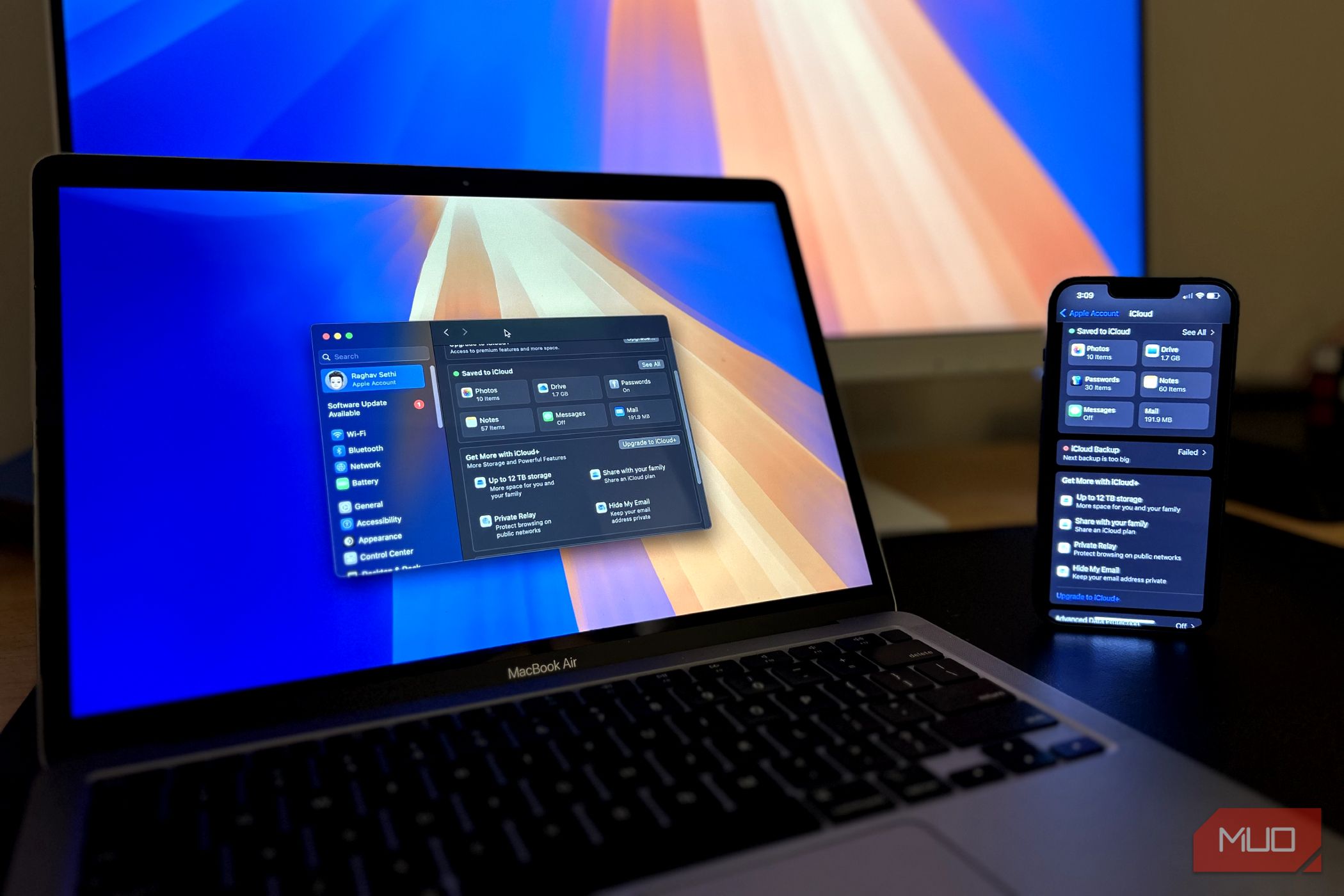 An iPhone and a MacBook with the iCloud menu open