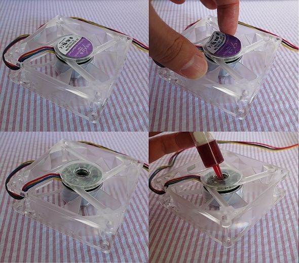 Процесс смазки вентилятора, шприц рядом с осью