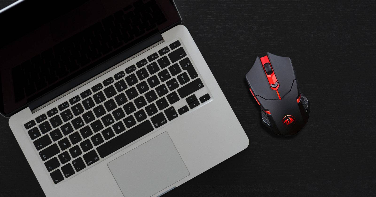 Third-party mouse next to a MacBook