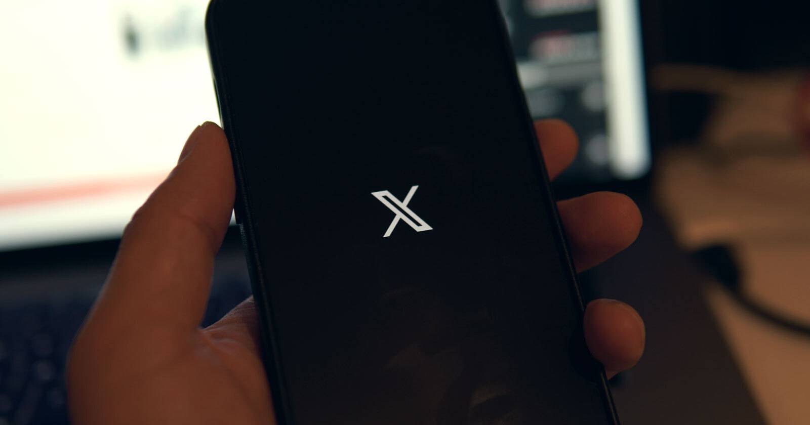 the x twitter logo on a smartphone