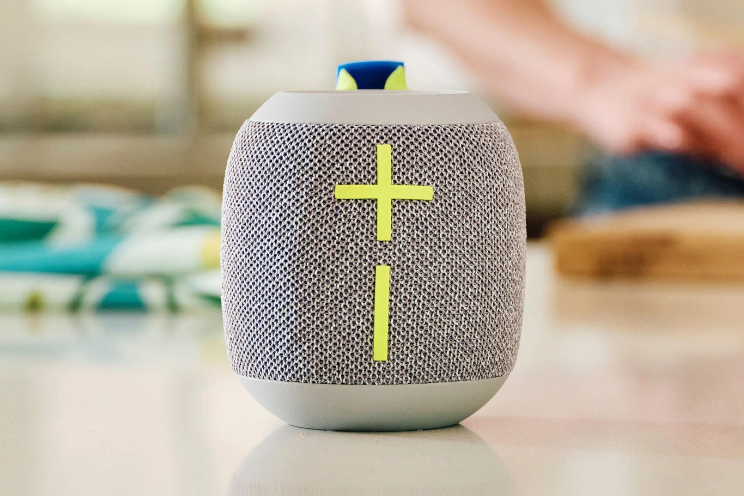 The UE Wonderboom 4 portable Bluetooth speaker on a table.