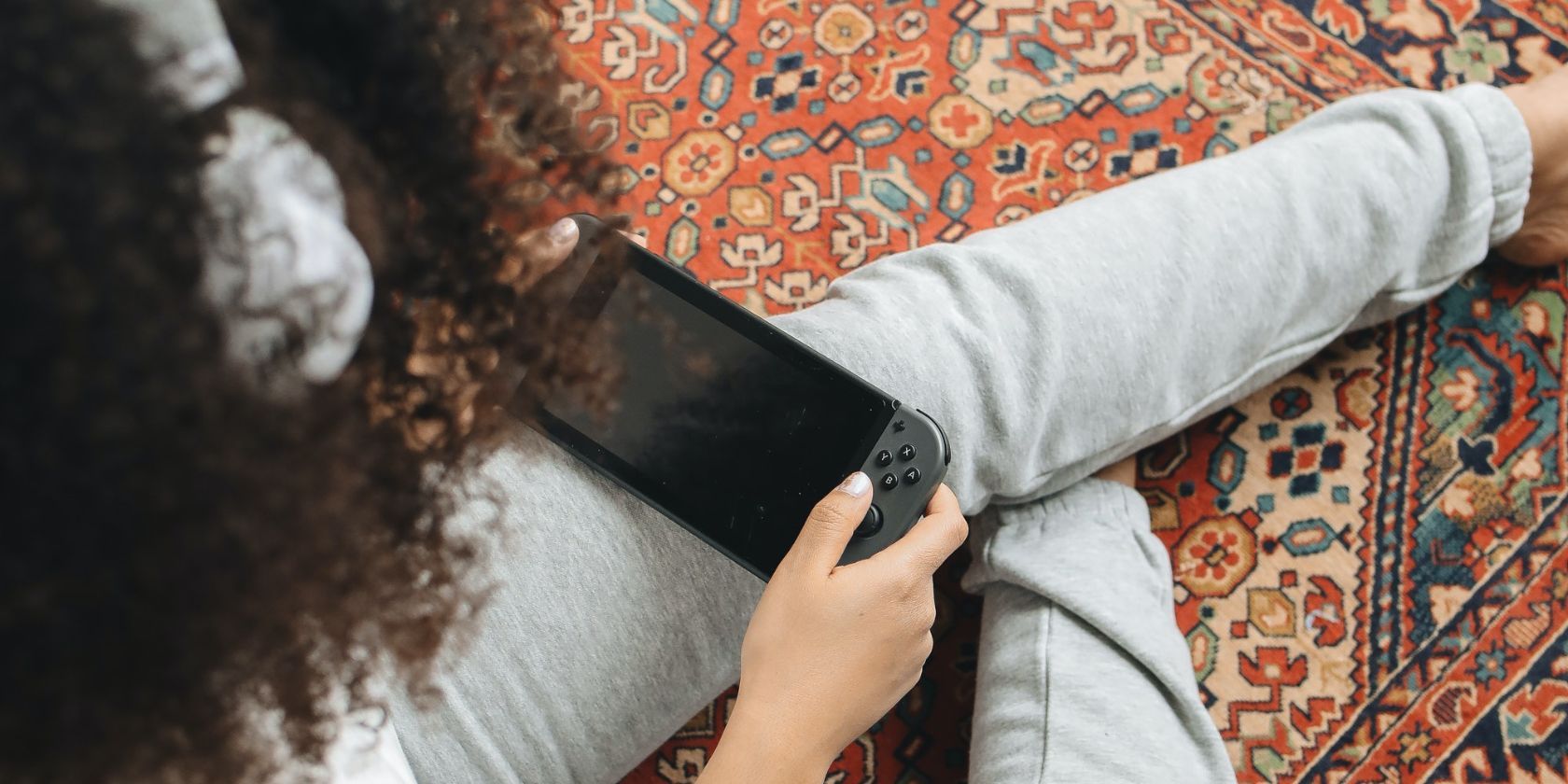 Girl playing with her nintendo switch