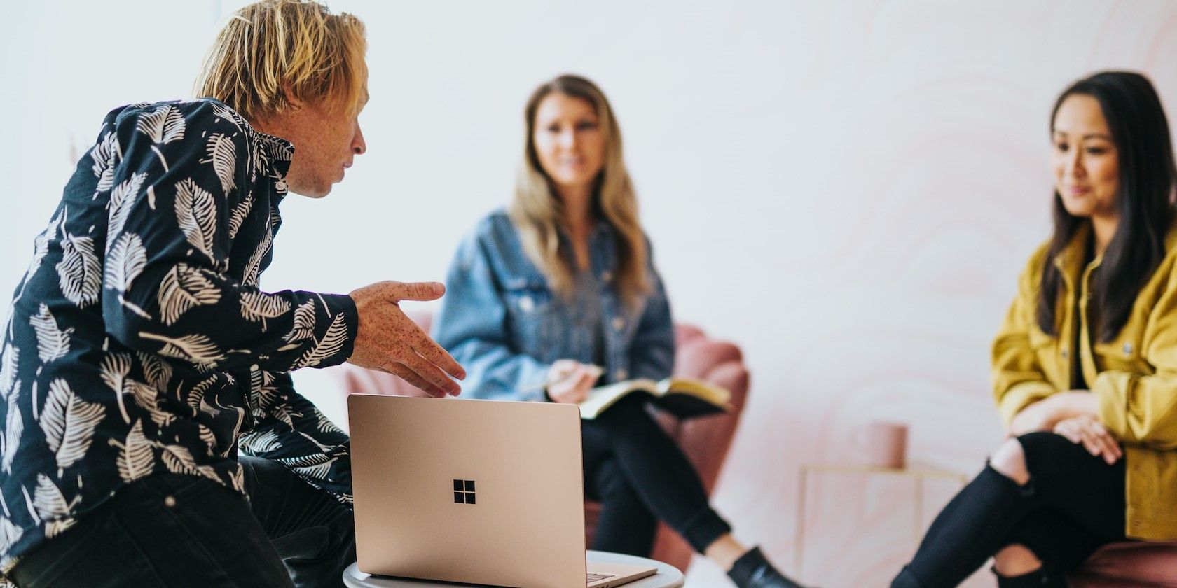 A Man Presenting his Work On a Windows Laptop