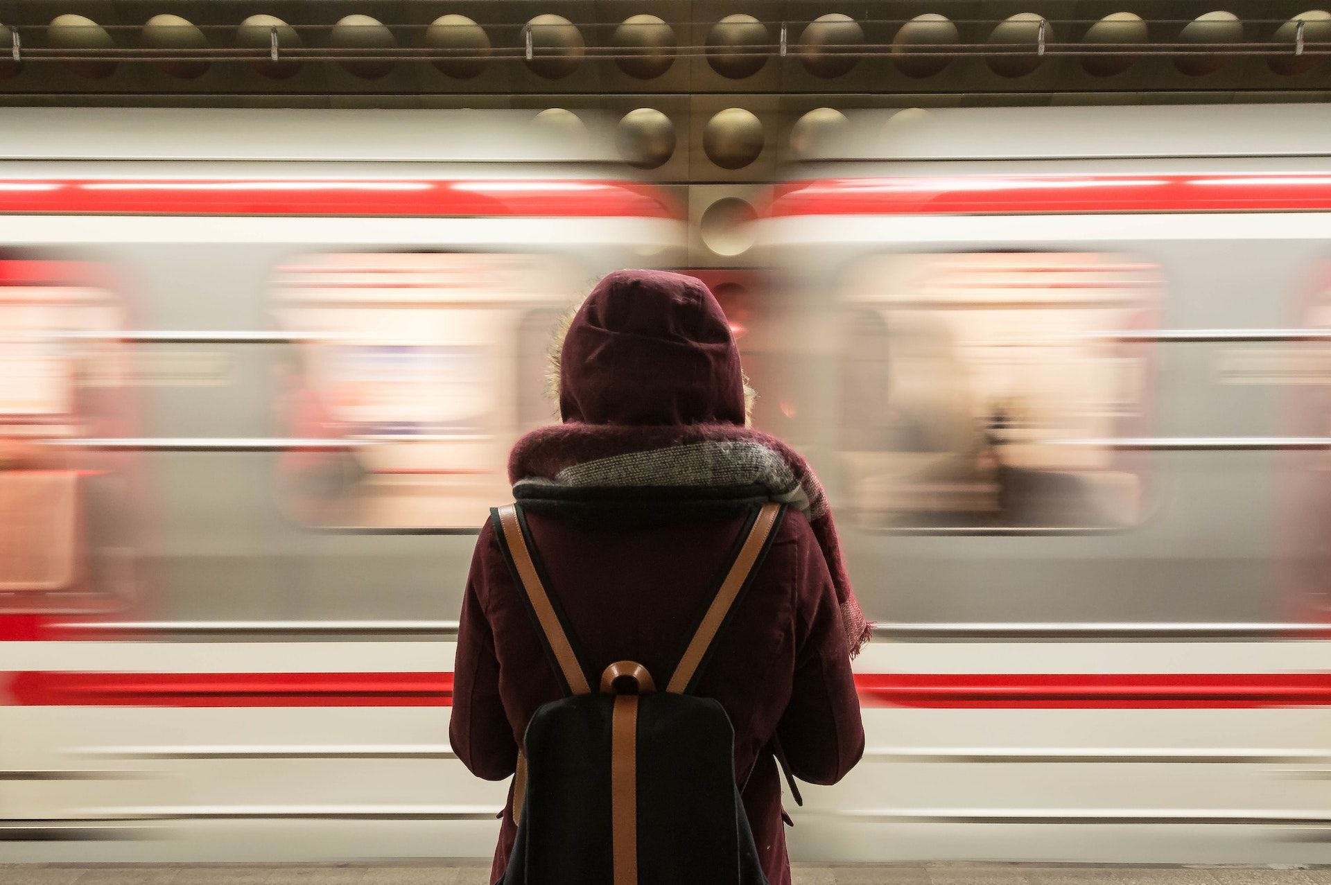 woman in front of moving train