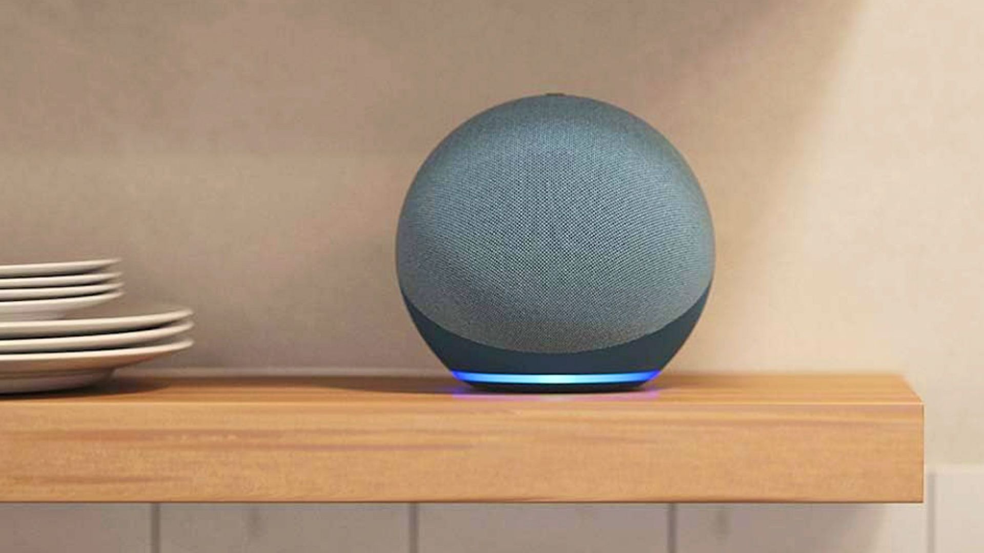 An Amazon Echo (4th Gen) sitting on a shelf.