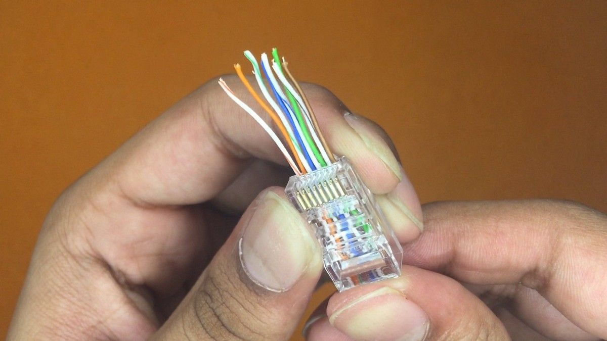 Pass through connector inserted with straight through arranged wires