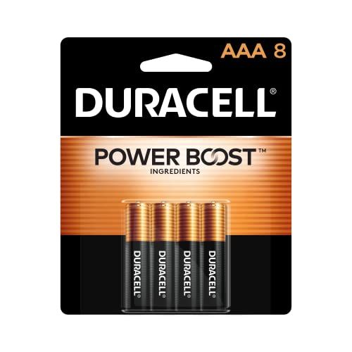 Пачка батареек Duracell AAA рядом с пультом.