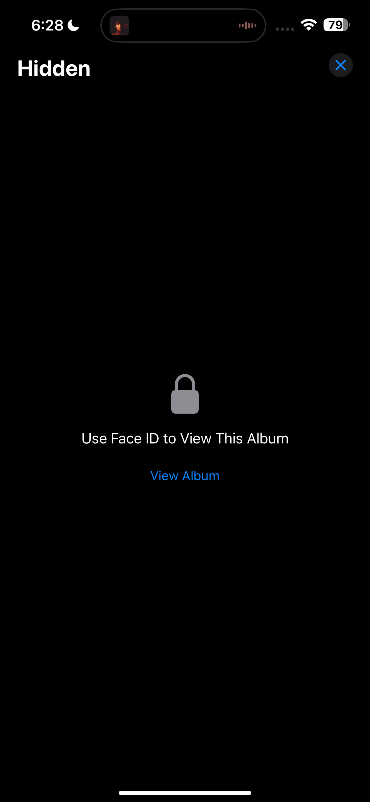 Hidden album displaying a message to use Face ID