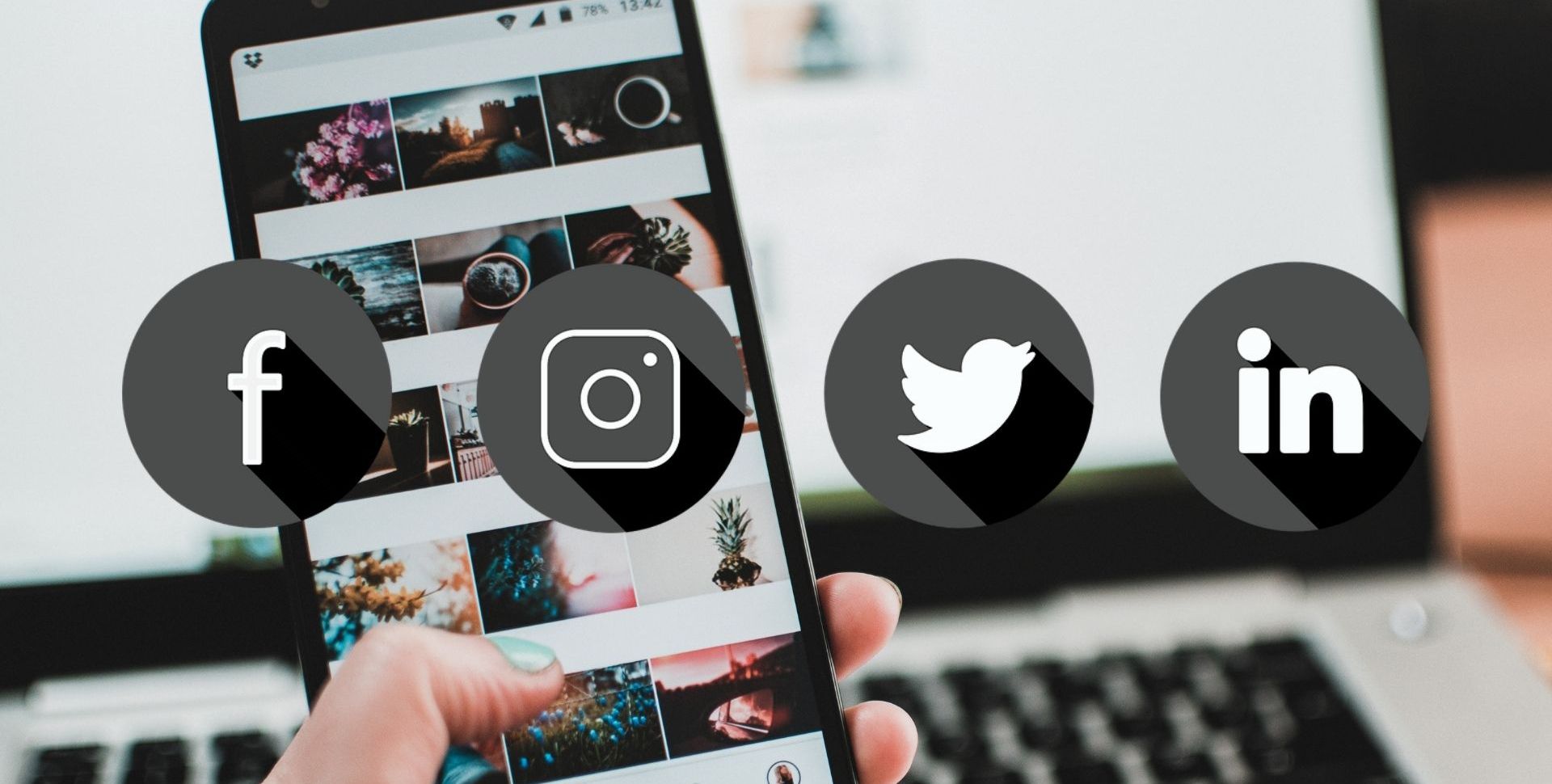 Иконки социальных сетей на фоне человека с телефоном и ноутбуком